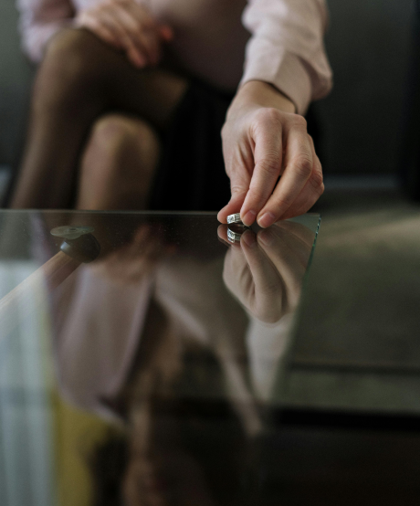 Women taking off and setting down her wedding ring