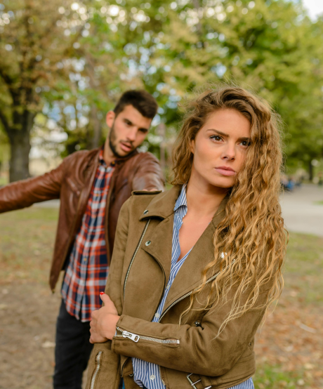 Women walking away from her husband after a breakup Women walking away from her husband after a breakup